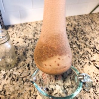 Panty hose used as a strainer. You squeeze out the gel and contain the seeds.